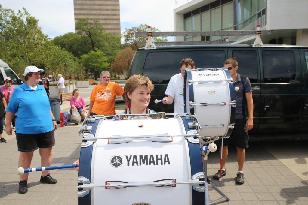 Linda Martin from Centre Street House had a chance to try out one of the drums after the walk!